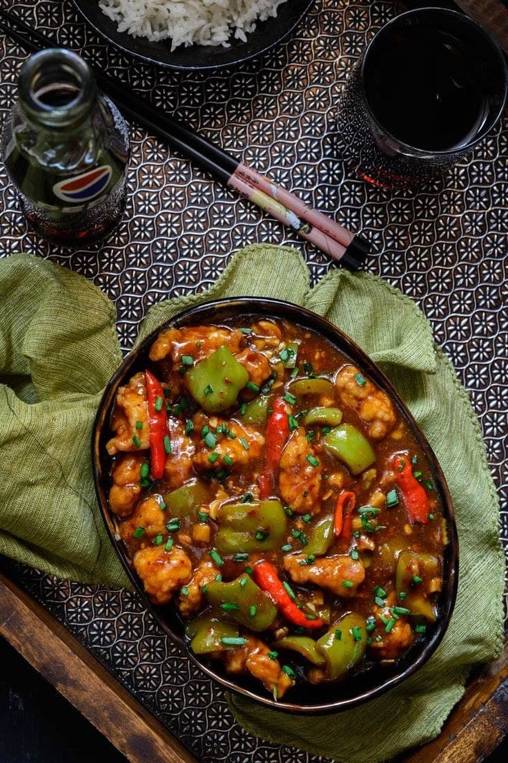 Pollo piccante con peperoni e cipolle